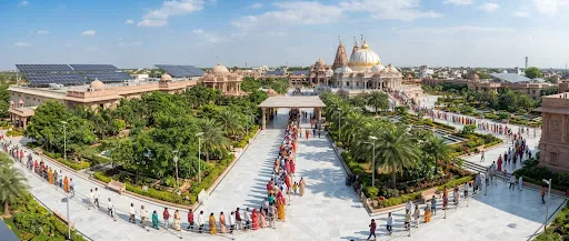 Modern wide panorama of Shegaon pilgrim complex showing landscaped walkways and marble corridors